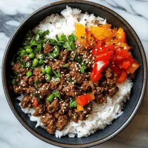 Ready for a quick and satisfying meal? This Beef and Pepper Rice Bowl combines tender beef strips with colorful bell peppers over a bed of fluffy rice, making it a perfect comfort dish. Packed with flavor and easy to prepare, it's great for busy weeknights or casual get-togethers. Save this recipe now and impress your friends and family at your next dinner!