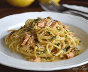 Delicious smoked salmon carbonara pasta with creamy sauce and fresh herbs