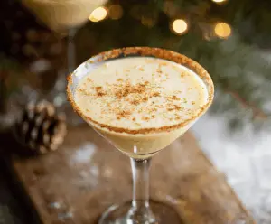 Creamy Eggnog Martini in a elegant glass garnished with nutmeg, perfect for holiday celebrations