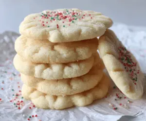 Delicious melt-in-your-mouth sugar cookies fresh out of the oven, perfect for any occasion.
