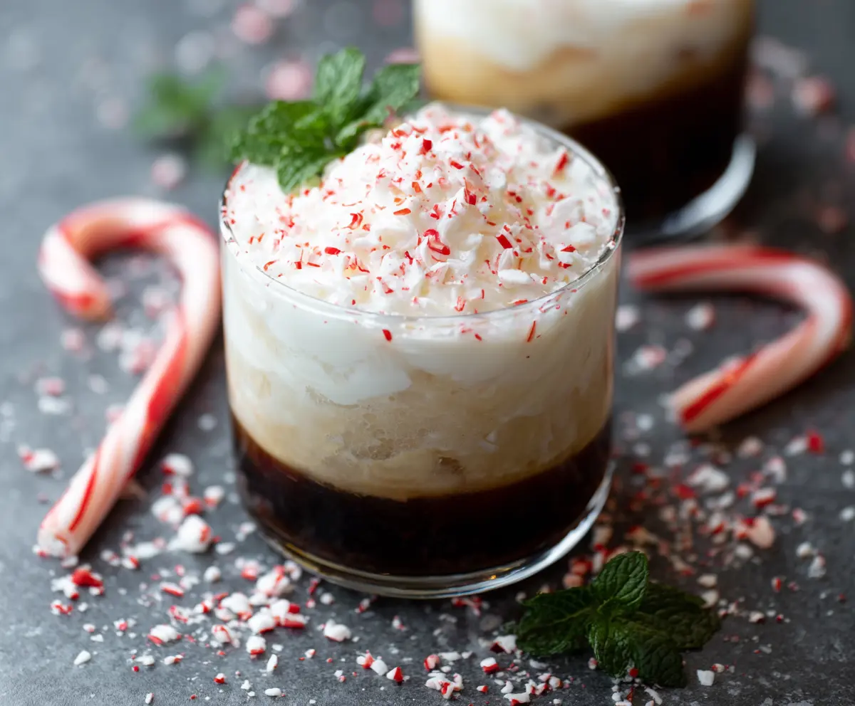 Delicious Peppermint White Russian cocktail garnished with peppermint and served in a glass.