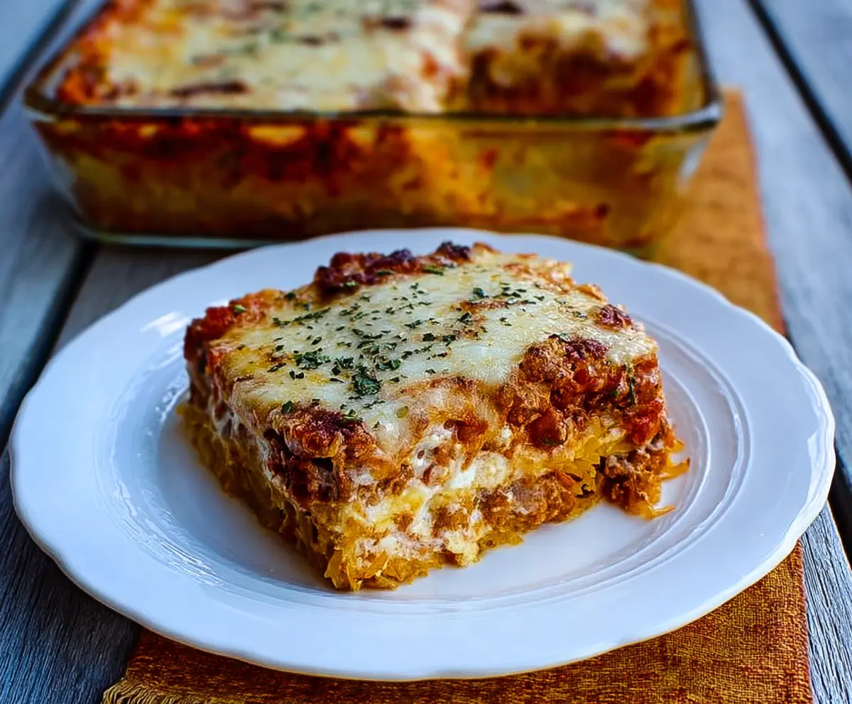 Delicious baked spaghetti squash lasagna with layers of cheese and marinara sauce.