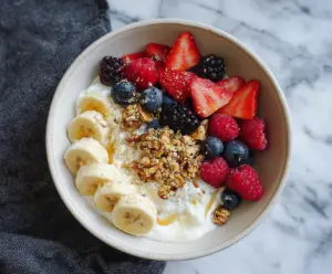 Healthy protein yogurt bowl with fresh fruits and granola for breakfast or snack.
