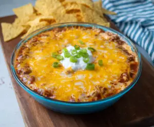 Cream Cheese Chili Dip served with fresh tortilla chips for a spicy appetizer.