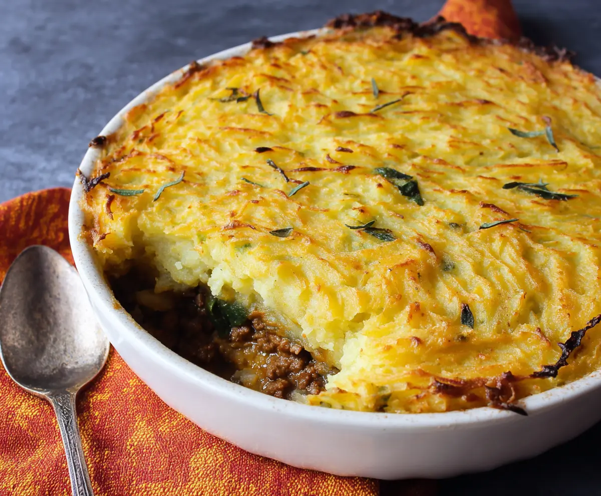 Delicious homemade Irish Cottage Pie topped with golden mashed potatoes and savory beef filling.