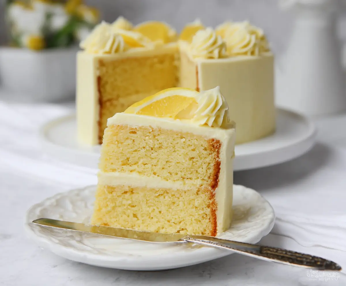 Delicious Lemon Velvet Cake with smooth frosting and fresh lemon slices on top