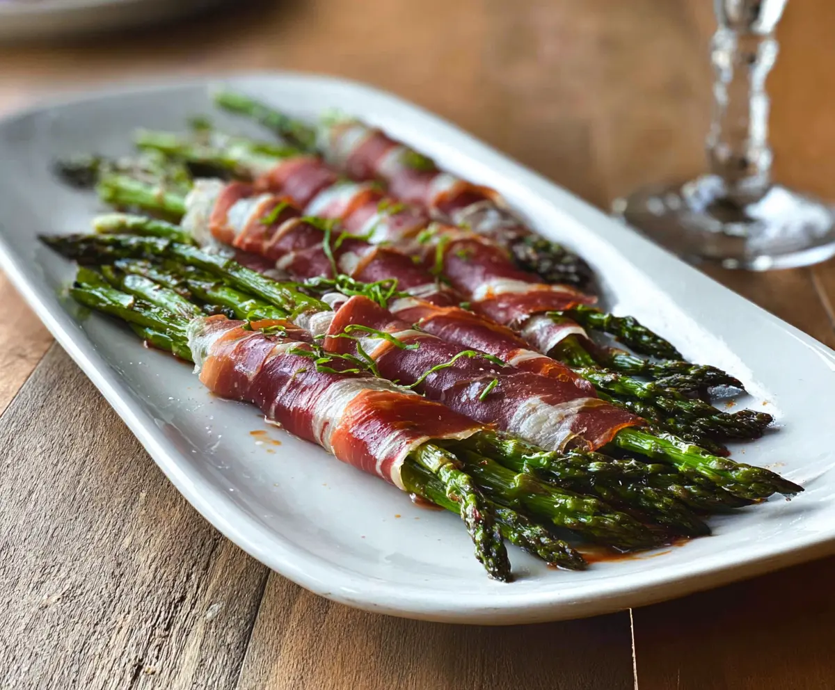 Delicious prosciutto wrapped asparagus spears, perfect for appetizers and parties.