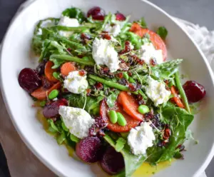 Fresh spring salad with goat cheese, vibrant greens, and colorful vegetables for a healthy meal
